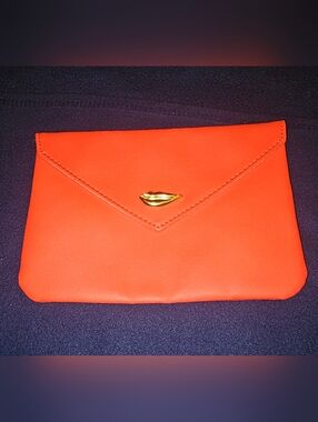 Ipsy "Sealed With A Kiss" makeup bag in red orange faux leather gold lip snap